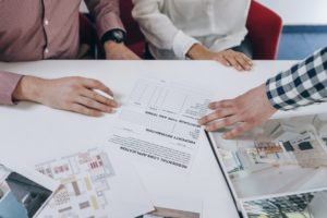 Real Estate Agency. Young Couple Signing Financing Contract