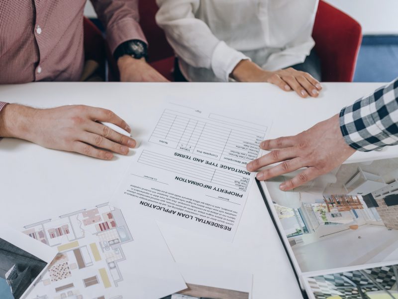 Real Estate Agency. Young Couple Signing Financing Contract