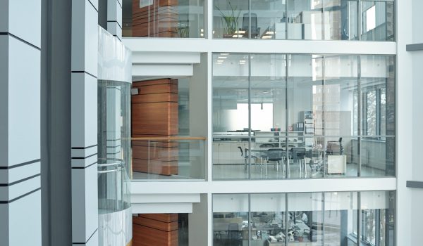 Several floors inside large business center with balconies, windows and offices